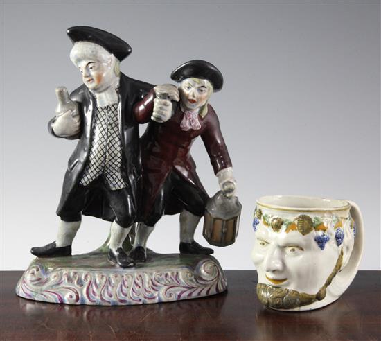 A pearlware Bacchus mug and a Staffordshire style nightwatchman group, 23cm & 9cm (9in. & 3.5in.)